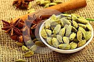 Bowl of organic cardamom pods and spices.