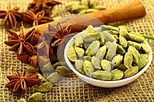 Bowl of organic cardamom pods and spices.