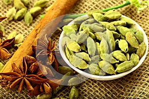 Bowl of organic cardamom pods and spices.