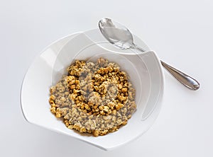 Bowl of organic granola with spoon
