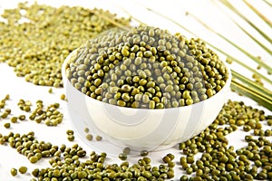 Bowl of Organic raw mung beans  background.