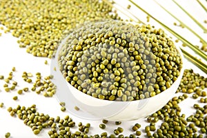 Bowl of Organic raw mung beans  background.