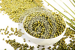 Bowl of Organic raw mung beans  background.