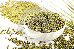 Bowl of Organic raw mung beans  background.