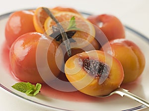 Bowl of Peaches Poached in Sauternes Wine