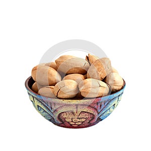 Bowl with pecan nuts in shell isolated