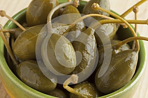 Bowl with pickled caperberries