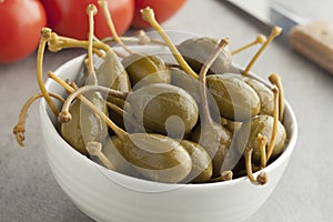 Bowl with pickled caperberries