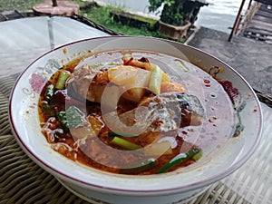 A bowl of Pindang Ikan Patin dish photo