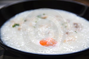 A bowl of porridge on background.