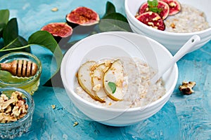 A bowl of porridge with pears slices and walnuts