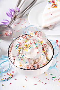 Bowl portion of birthday cake taste ice cream