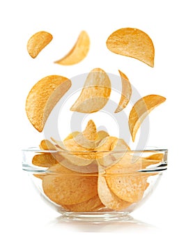 Bowl of potato chips isolayed on white