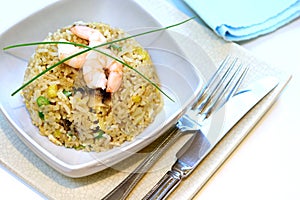 A bowl of prawn, mushroom and egg stir fried rice