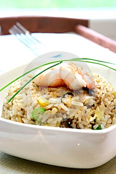A bowl of prawn, mushroom and egg stir fried rice