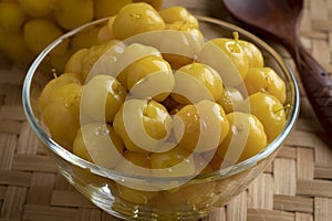 Bowl with preserved star gooseberry, Mayom close up