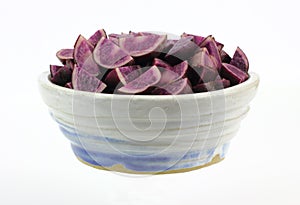 Bowl of Quartered Purple Potatoes