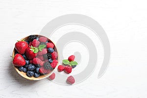 Bowl with raspberries and different berries