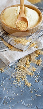 Bowl of raw Amaranth flour with a spoon of Amaranth seeds