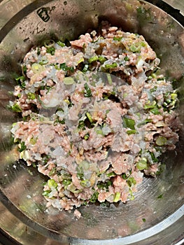 Bowl of raw minced pork and shrimp