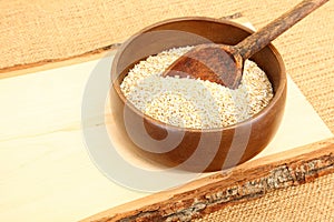 Bowl of Raw Oatmeal in Wooden Bowl