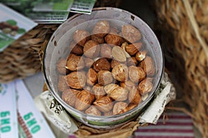 Bowl of raw peeled hazelnuts. Vegan food