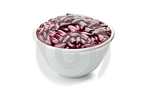 Bowl of raw red beans on white