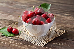 Bowl with red cherries photo