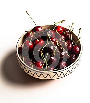 Bowl with red cherries