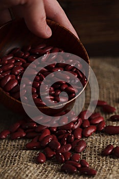 Bowl of red haricot beans on sackcloth. Stock image