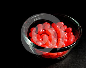 Bowl of red jellybeans