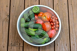 Bowl Of Red Tomatoes And Green Cucumbers 