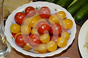 Bowl of red and yellow cherry tomatoes