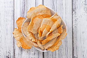 Bowl with rippled Potato Chips