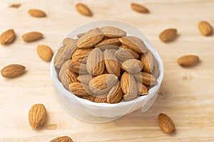 A bowl of roasted almonds, Nuts are low in carbs but high in healthy fats, protein, and fiber close-up shot