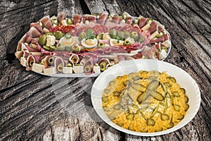 Bowl Of Russian Salad With Traditional Serbian Appetizer Savory Dish Meze Served On Weathered Cracked Wooden Garden Table