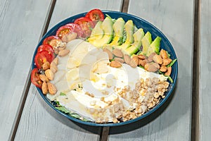 A bowl with salad on a picnic table