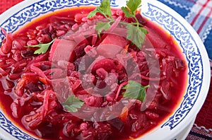 Bowl of sauerkraut soup with beet and pearl barley