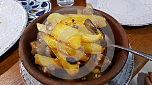 Bowl with sauted potatoes and mushrooms photo