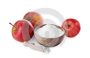 Bowl, scoop with sweet fructose powder and ripe apples on white background