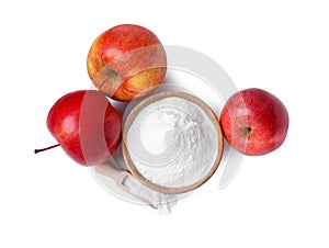 Bowl, scoop with sweet fructose powder and ripe apples on white background, top view