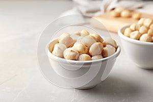 Bowl with shelled organic Macadamia nuts