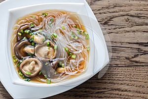 Bowl of shiitake soup on the wooden table