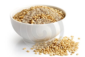 Bowl of short grain brown rice isolated on white.