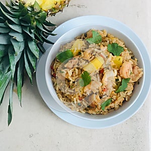 A bowl of shrimp and pineapple fried rice photo