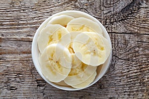 Bowl of sliced banana from above