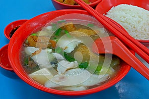 A bowl of sliced fish soup - a favorite local dish made of fish, vegetables and beancurd in broth.