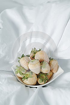 bowl with some white strawberries