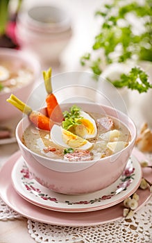 Bowl of the sour soup ÃÂ»urek, polish Easter soup with the addition of sausage, hard boiled egg and vegetables