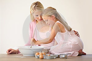 Bowl, spoon and baking mom, child or family mix ingredients, food or prepare meal, flour or recipe. Home kitchen counter